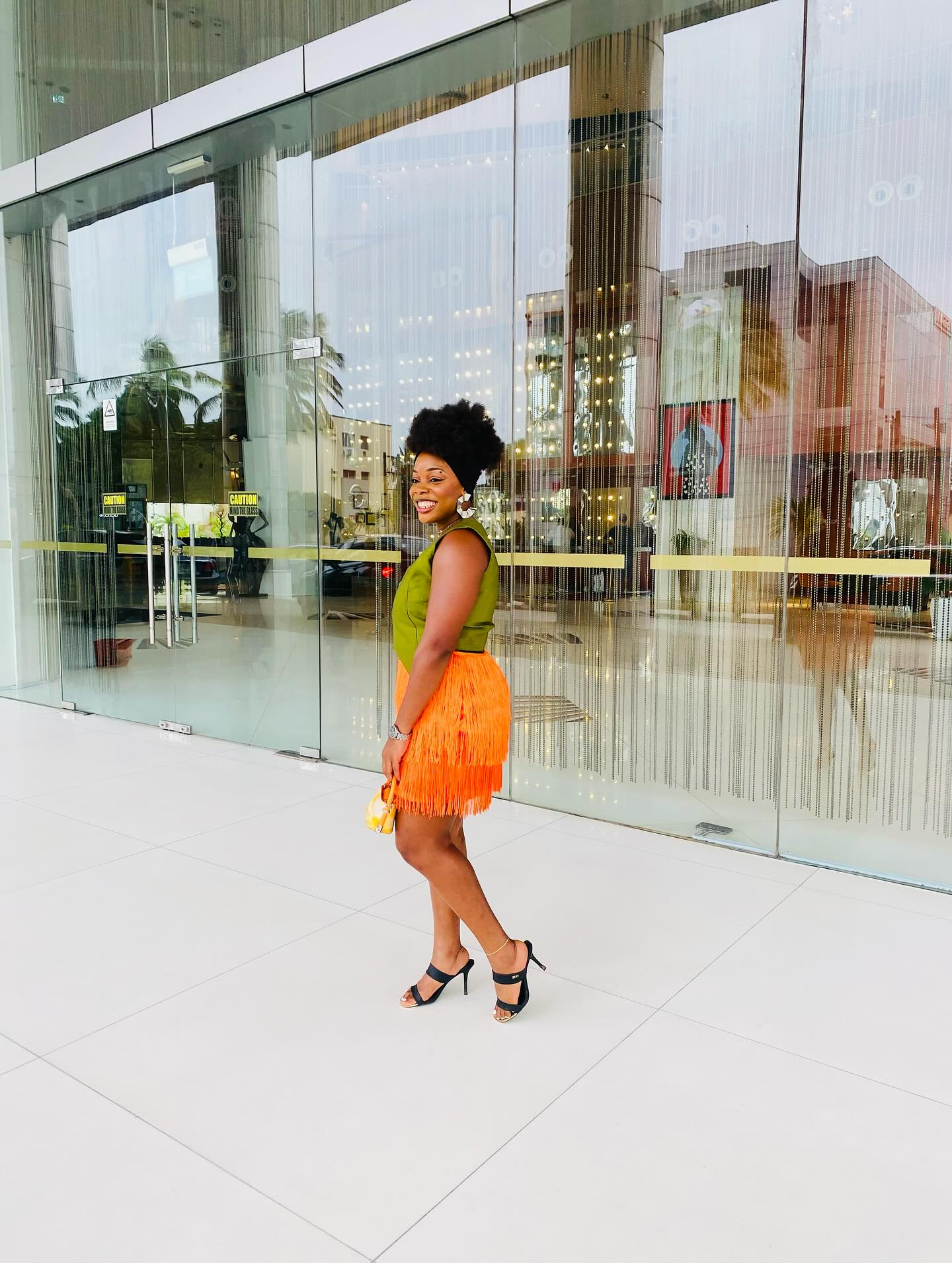Olive crop and tangerine fringe skirt — city energy.